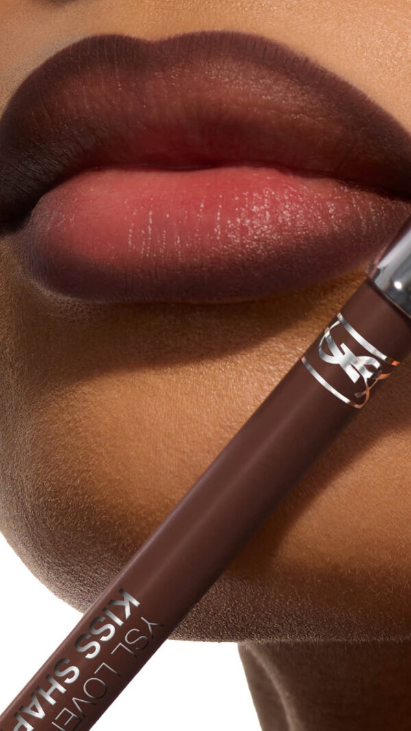 Bineta's lips with YSL LOVENUDE Kiss Shaper 26 in Shade 110, a close- up showcasing the product.