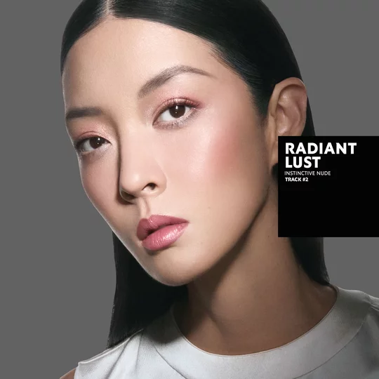 So-Young, fair skin tone, with an instinctive nude eye look and radiant lust pink glossy lips, wearing a white top.