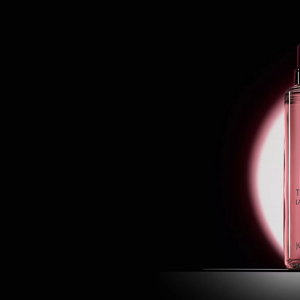 Black Opium Eau de Parfum bottle shown next to its 100ml glass refill bottle with the YSL logo.