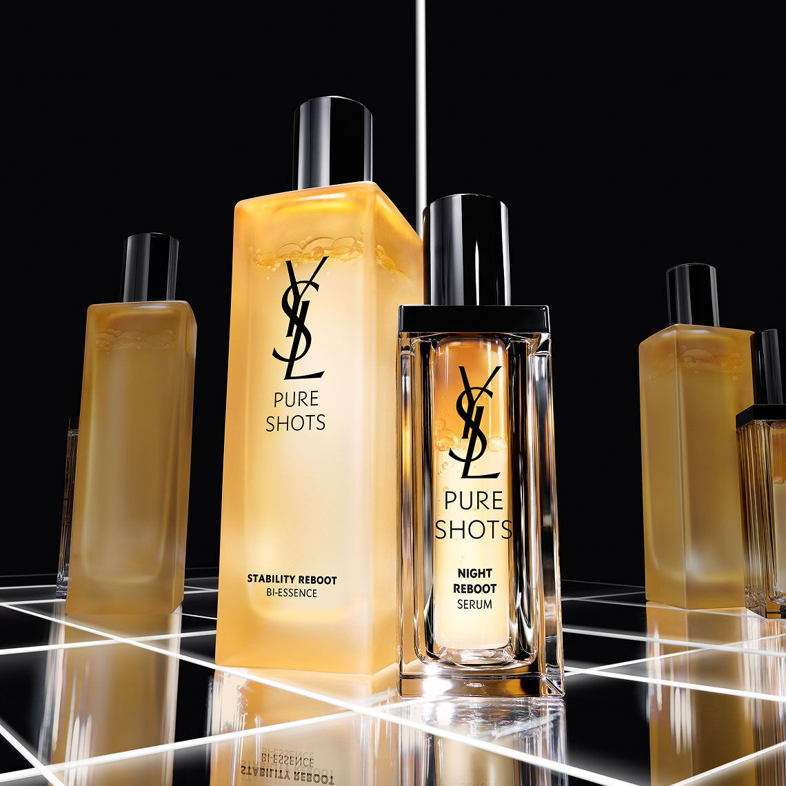 YSL Pure Shots Night Reboot Serum and Stability Reboot Bi-Essence bottles in a sleek, modern lab setting.