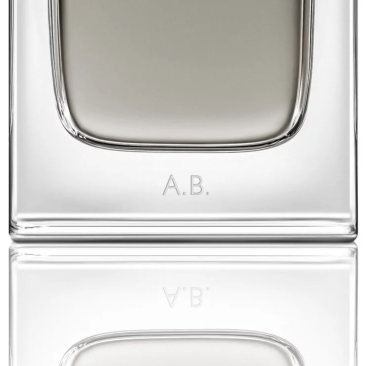 Close-up of the MYSLF Eau de Toilette Intense bottle base featuring personalized A.B. initials engraving.