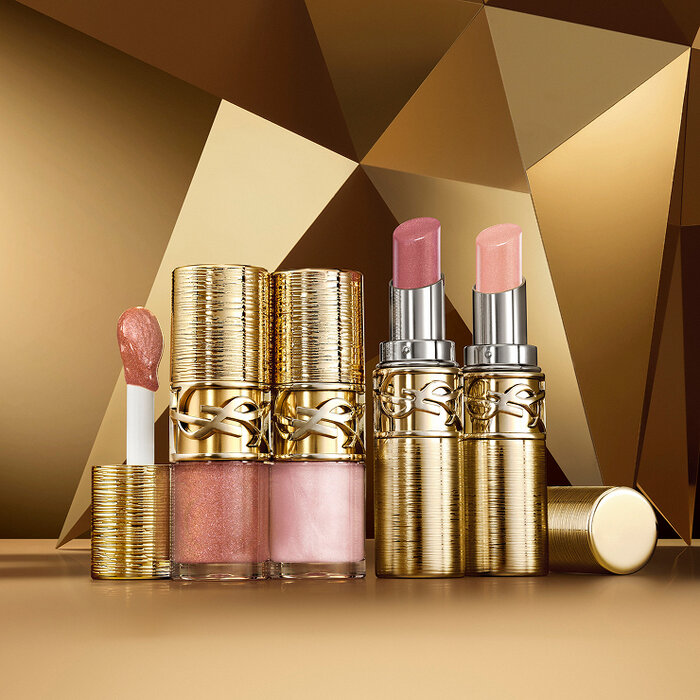 YSL Loveshine Plumping Lip Oil Gloss shade 12 and 100, and Loveshine Candy Glaze Collector in shades 22, and 21 on a gold background.