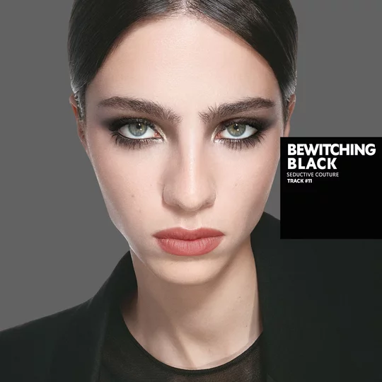 Loli, light skin tone, with a seductive couture bewitching black eye look and nude lips.