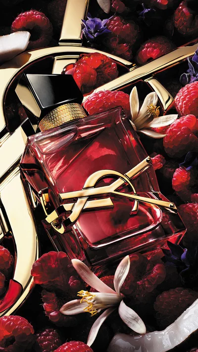 YSL Libre bottle with raspberries, creamy coconut, jasmine flowers, and lavender accents.