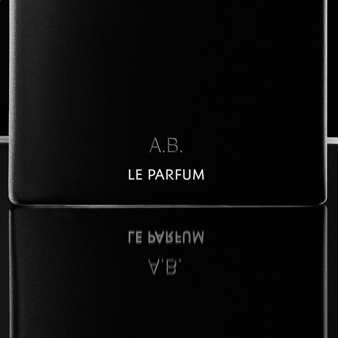 Close-up of a personalized YSL MYSLF Le Parfum bottle, engraved with 'A.B.', showcasing the art of luxury gifting.