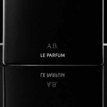 Close-up of a personalized YSL MYSLF Le Parfum bottle, engraved with 'A.B.', showcasing the art of luxury gifting.