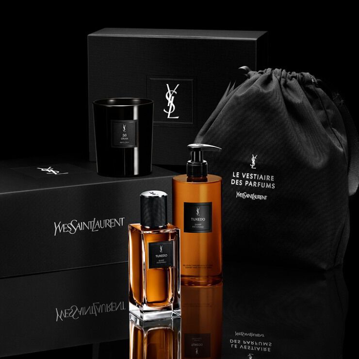 YSL Tuxedo fragrance and body wash next to an exclusive gift box and black pouch by YSL Beauty.