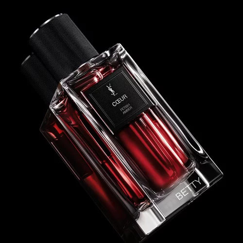 Close-up of the COEUR bottle demonstrating the YSL custom engraving and personalization service.