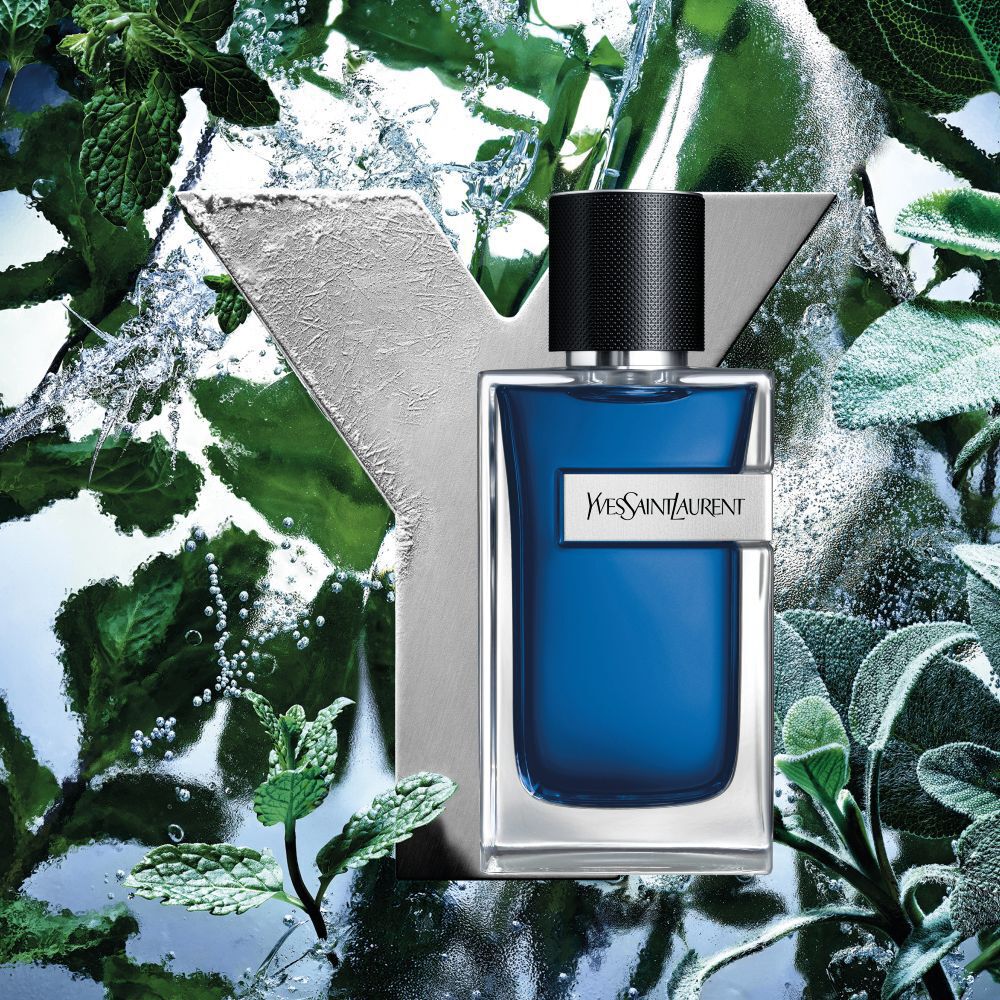 YSL Y Eau de Toilette Intense Iced Cologne bottle, frosted Y logo,  fresh mint leaves, and icy water splashes.