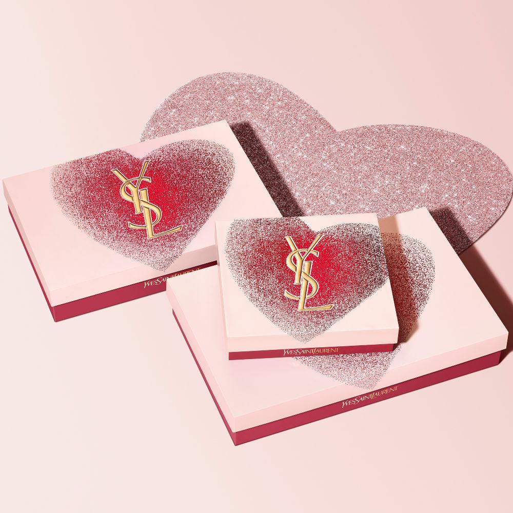 YSL Beauty Valentine's day gift sets in various sizes, featuring a glittery red heart design with the gold YSL logo.