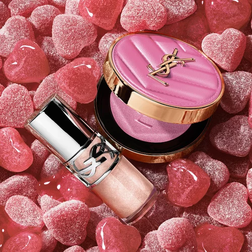 YSL LOVESHINE Plumping Lip Oil Gloss shade 10 and Make Me Blush shade 10, surrounded by pink heart-shaped sweets.