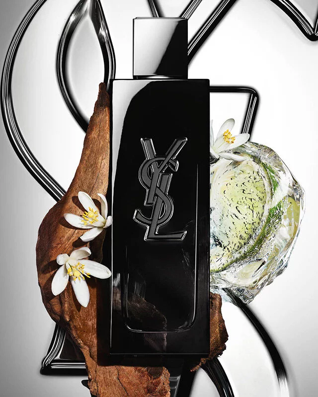 MYSLF Eau de Parfum bottle by YSL Beauty surrounded by fresh bergamot, orange blossom and woods.