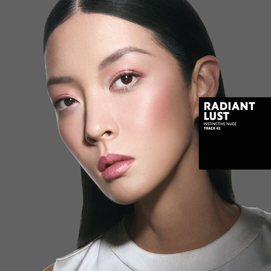 So-Young, fair skin tone, with an instinctive nude eye look and radiant lust pink glossy lips, wearing a white top.