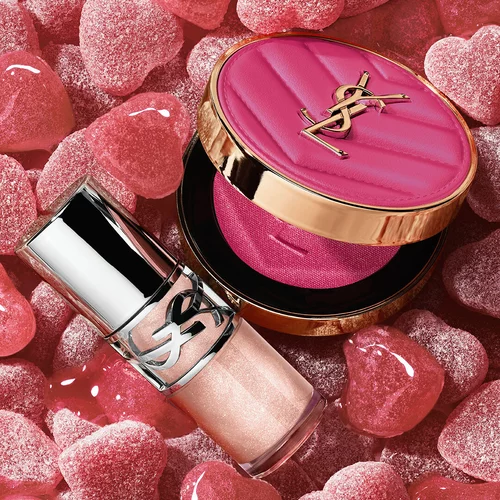 YSL LOVESHINE Plumping Lip Oil Gloss shade 10 and Make Me Blush shade 10, surrounded by pink heart-shaped sweets.
