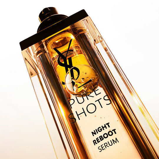 Close-up of YSL Pure Shots Night Reboot Serum bottle, representing the YSL Beauty skincare category.