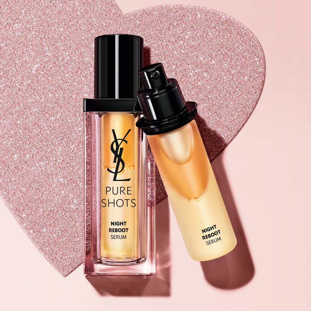 YSL Pure Shots Night Reboot Serum, on bottles and its refill on a glittery heart background.