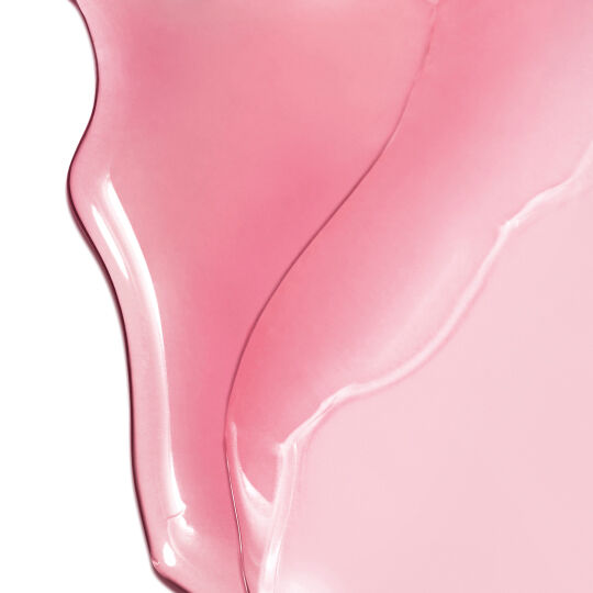 YSL LOVESHINE Candy Glow in shade 1B, a smooth, glossy pink texture with a luminous finish.