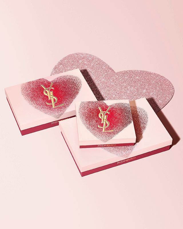 YSL Beauty Valentine's day gift sets in various sizes, featuring a glittery red heart design with the gold YSL logo.
