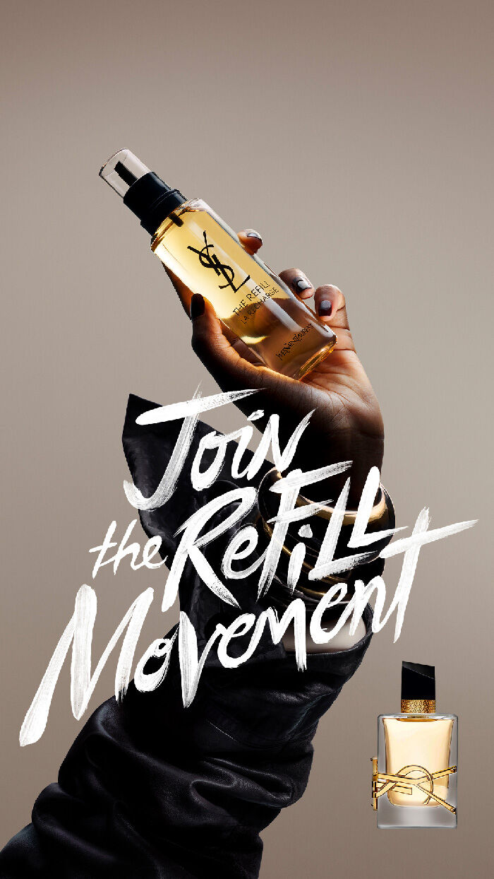 World Refill Day campaign banner featuring a hand holding a YSL refill fragrance bottle with bold “Join the Refill Movement” lettering on a soft beige background.