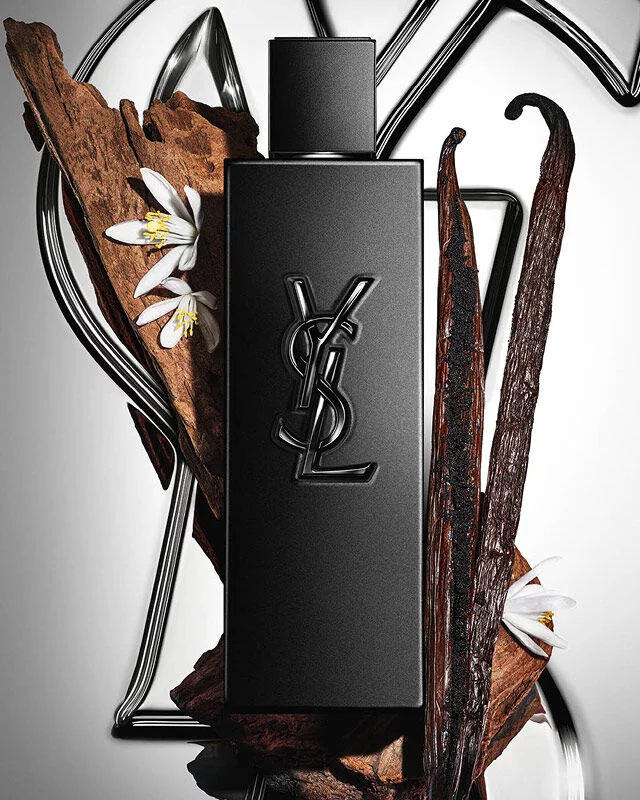MYSLF Le Parfum matte black bottle by YSL Beauty surrounded by vanilla pods, orange blossom and woods.