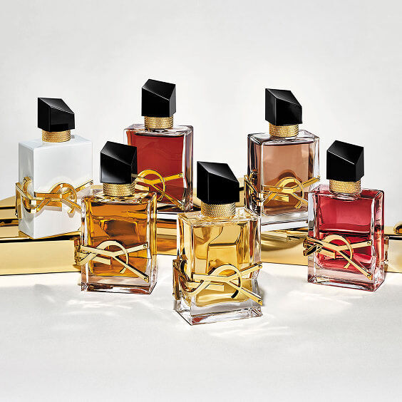 A luxurious display of the YSL Libre fragrance range, featuring multiple iconic bottles in various elegant shades.