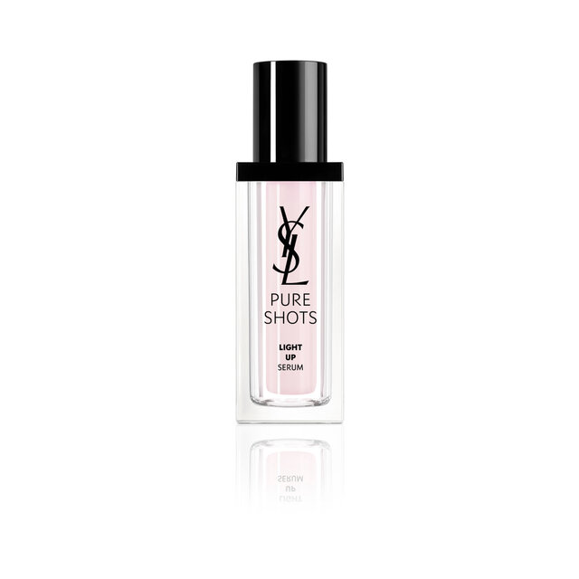 Pure Shots Light Up Serum bottle with black cap and pale pink-toned formula on a white background.