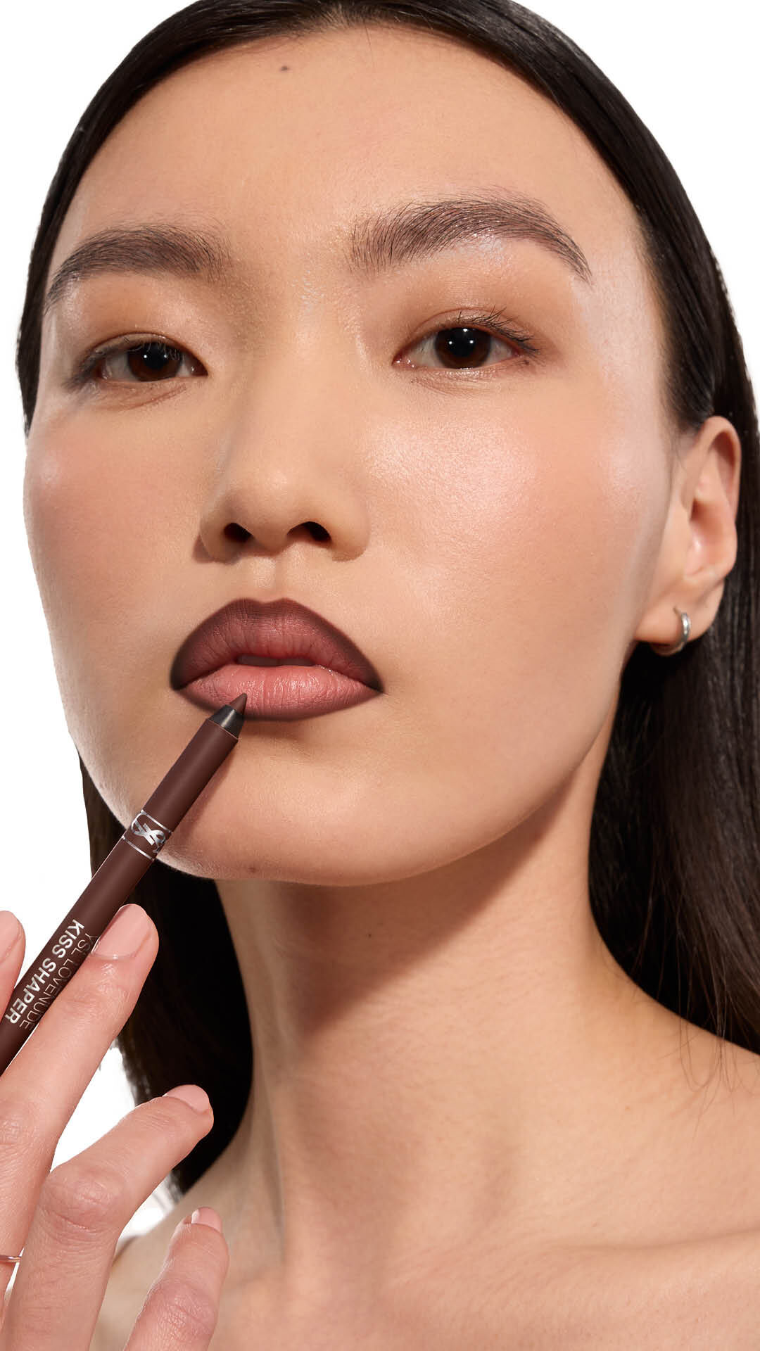 Jia Lu Yi applying YSL LOVENUDE Kiss Shaper 26 in Shade 110, full- face portrait on white background.