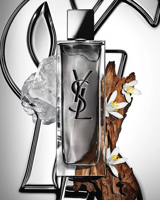 MYSLF Eau de Toilette Intense bottle by YSL Beauty surrounded by orange blossom, woods and white musk.