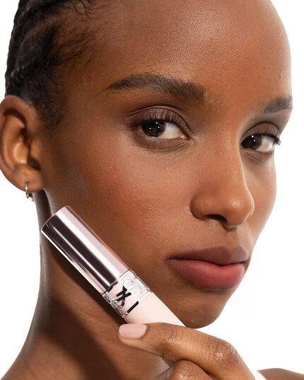 Zahara wearing YSL LOVENUDE Lip Blusher, shade 8, on medium skin, holding the product.