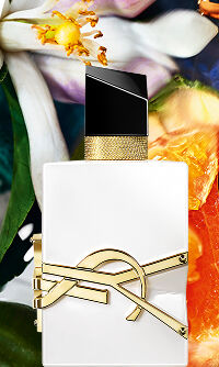 Libre Eau de Parfum bottle with gold YSL logo on clear glass and golden juice.