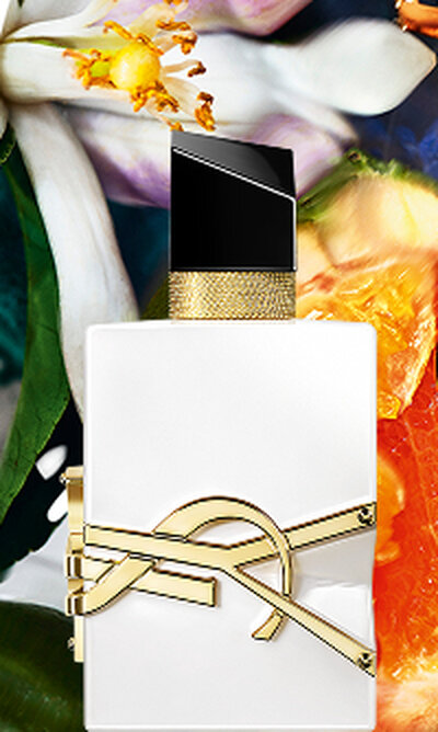Libre Eau de Parfum bottle with gold YSL logo on clear glass and golden juice.