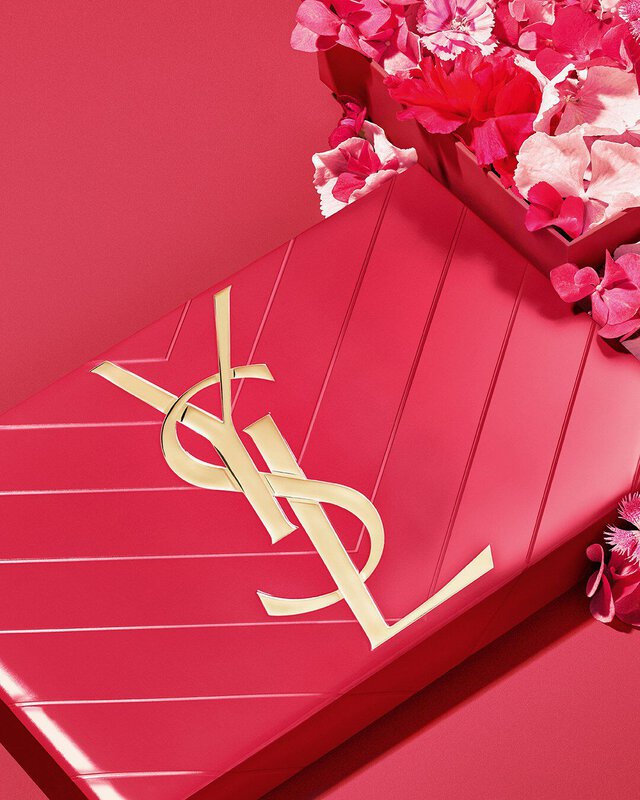 YSL Mother's Day pink gift set, featuring the iconic Cassandre logo, overflowing with delicate pink floral accents.