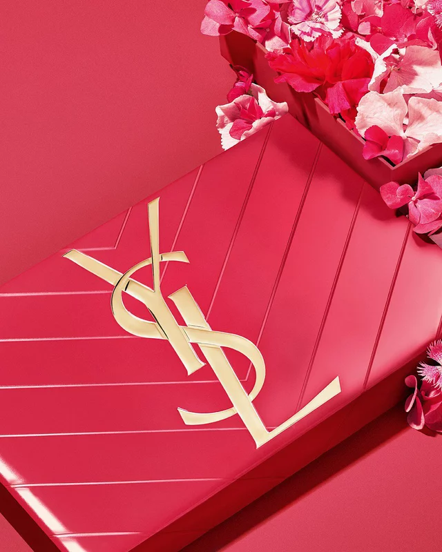 YSL Mother's Day pink gift set, featuring the iconic Cassandre logo, overflowing with delicate pink floral accents.