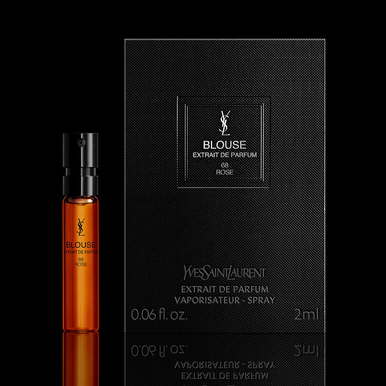 YSL Le Vestiaire des Parfums Blouse Extrait de Parfum 2ml sample vial and its black packaging, on a black reflective surface.