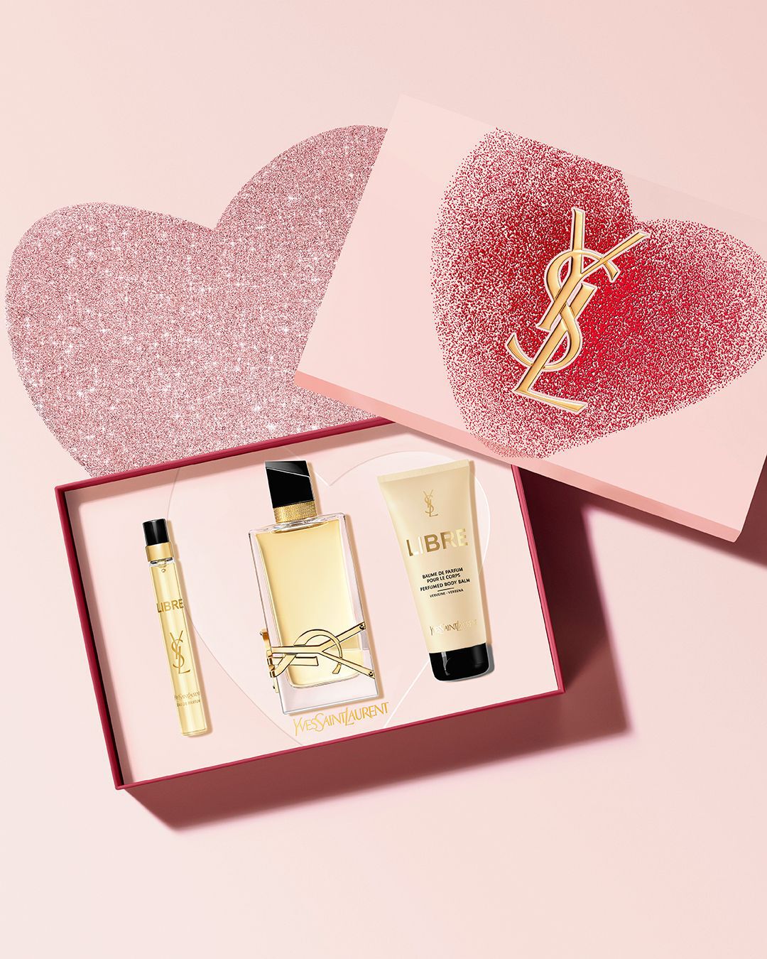 Libre Eau de Parfum Valentine's Day gift set, with 90ml, 10ml, and perfumed body balm, in a pink box with glitter hearts.