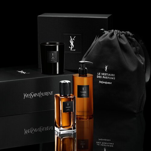 YSL Tuxedo fragrance and body wash next to an exclusive gift box and black pouch by YSL Beauty.