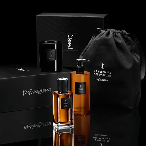 YSL Tuxedo fragrance and body wash next to an exclusive gift box and black pouch by YSL Beauty.