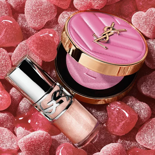 YSL LOVESHINE Plumping Lip Oil Gloss shade 10 and Make Me Blush shade 66, amidst vibrant pink heart-shaped sweets.