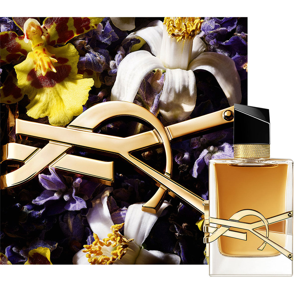 LIBRE EAU DE PARFUM INTENSE bottle surrounded by deep purple flowers and gold chain detail.