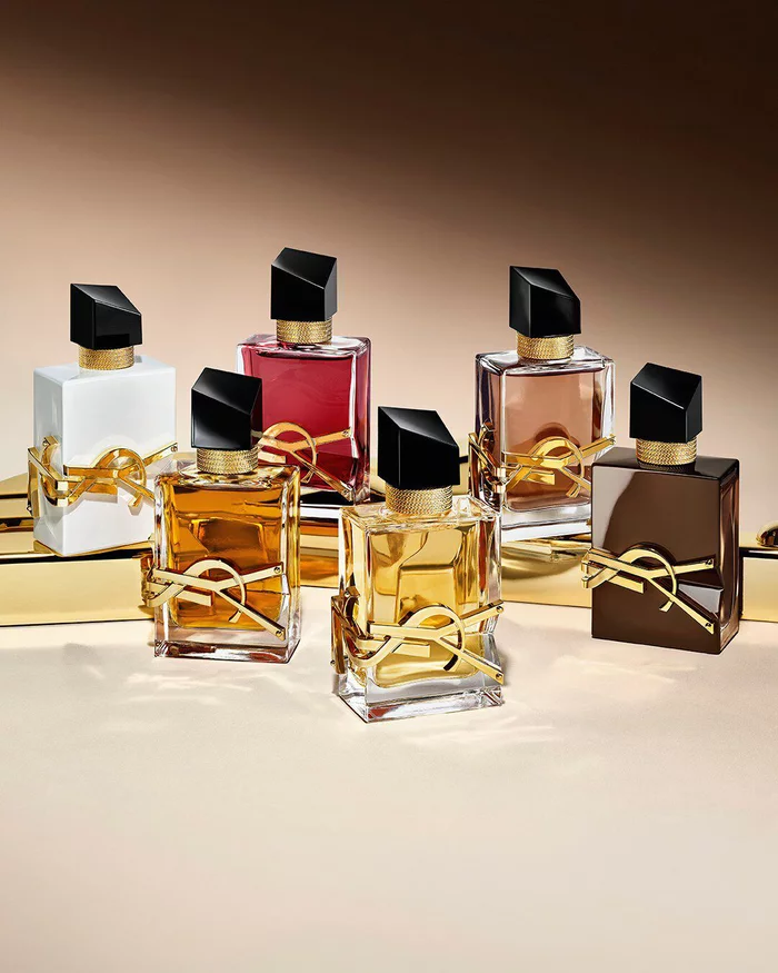 Collection of Libre fragrance bottles including the new glazed brown Libre Santal Couture.