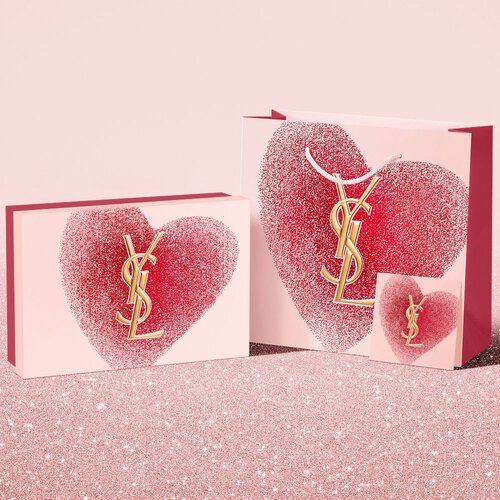 YSL Beauty Valentine's day gift set, gift card, and shopping bag, featuring a glittery red heart design with the YSL logo.