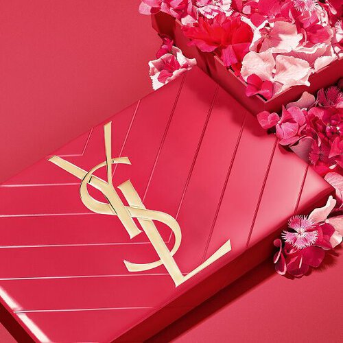 YSL Mother's Day pink gift set, featuring the iconic Cassandre logo, overflowing with delicate pink floral accents.