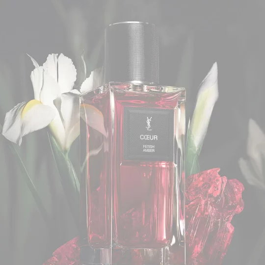 YSL LVDP Muse Eau de Parfum bottle, elegantly presented with striking white and black irises in the background.