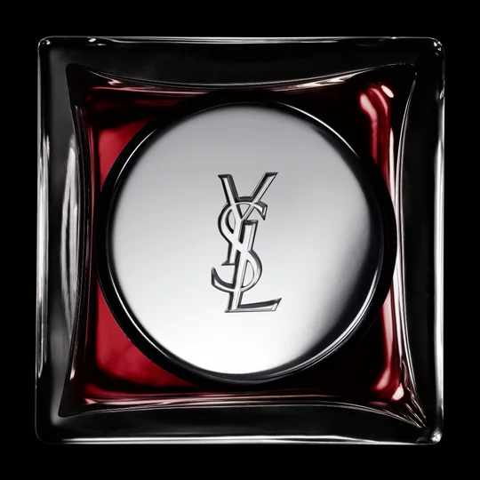 Top view of the COEUR Eau de Parfum bottle cap featuring the silver YSL Cassandre logo.