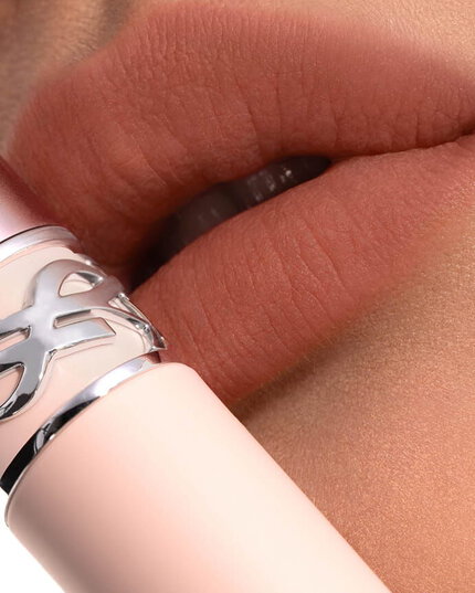 Mei J wearing YSL LOVENUDE Lip Blusher, shade 2, on fair skin. Portrait close-up.