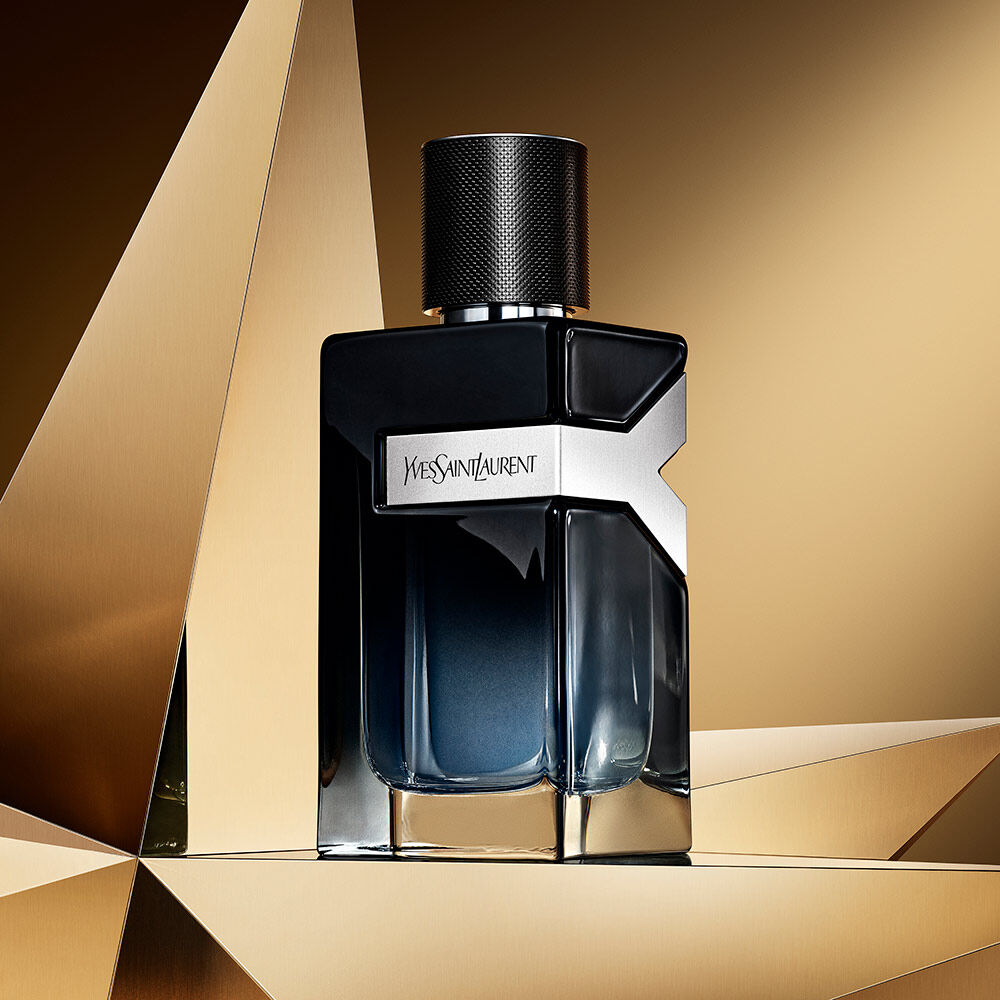 Y eau de parfum bottle on a golden background.