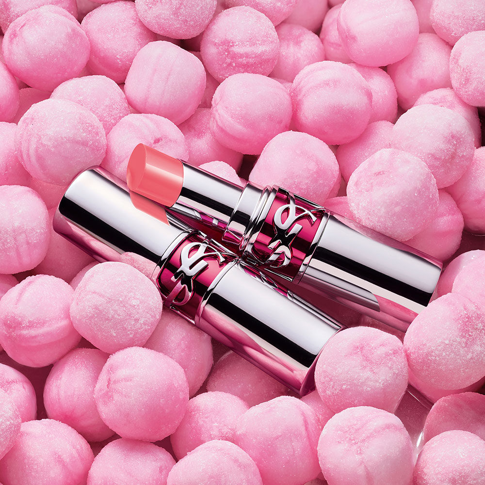 YSL LOVESHINE CANDY GLAZE lipstick on pink candy sweets in shade 18 Bubble Gum.