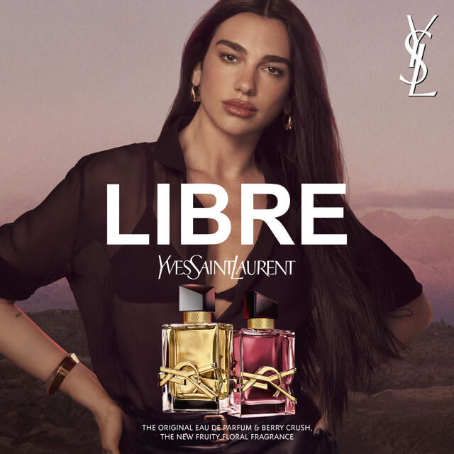 YSL Libre campaign visual with “LIBRE” text and two bottles: Libre Eau de Parfum and Libre Berry Crush.