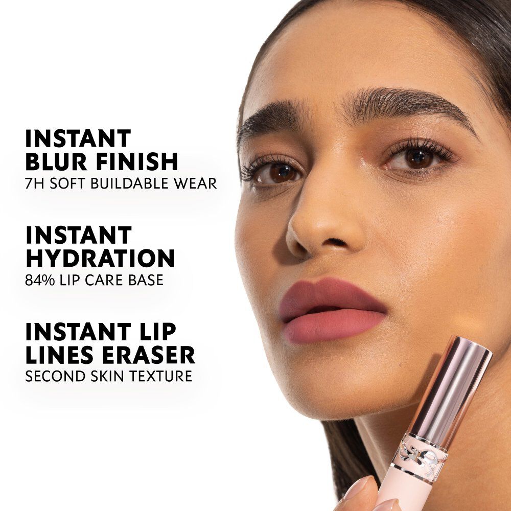 Model wearing YSL LOVENUDE LIP BLUSHER with soft blurred matte nude lip finish.