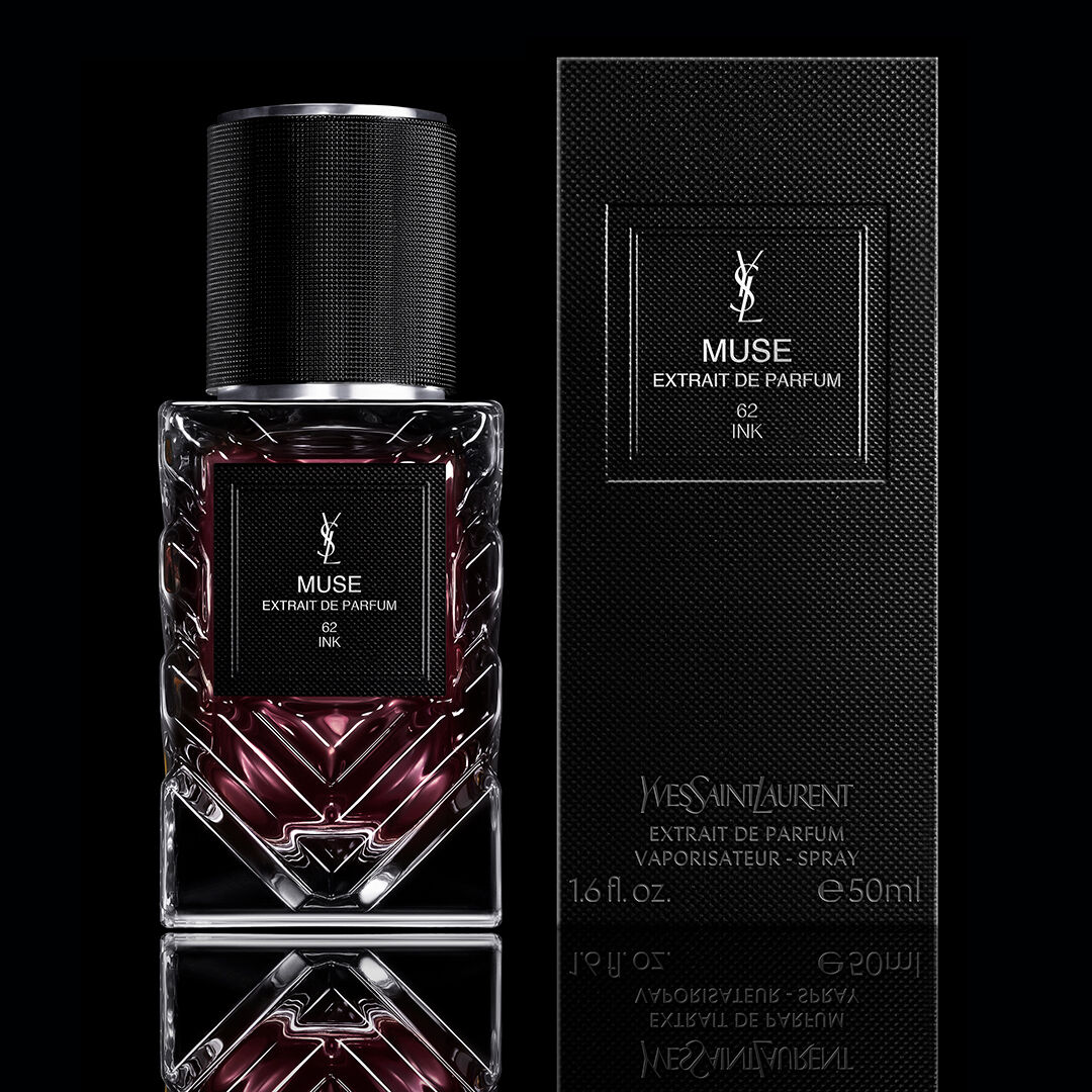 YSL Muse extrait de parfum bottle with outer packaging box on black background.